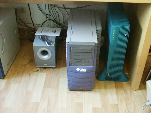 Sun Blade 1000 and SGI Indigo 2 standing side by side under a desk